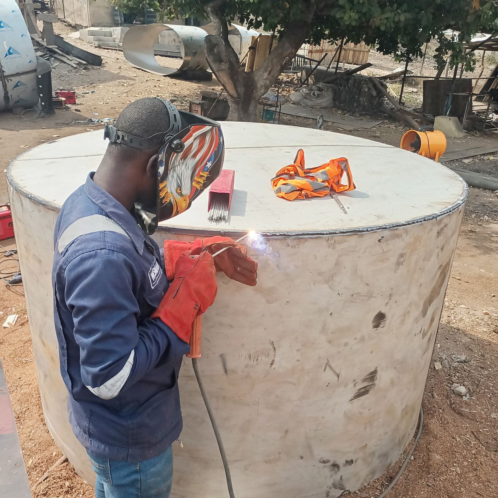 Field welding on a steel holding tank